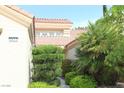 Front door view of well landscaped house with decorative plants and walkway leading to the entrance at 2633 Legend Dr, Las Vegas, NV 89134