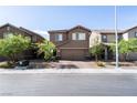 Charming two-story home featuring a two-car garage, well-kept landscaping, and a welcoming brick-paved driveway at 3553 Judson Ave, Las Vegas, NV 89115