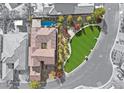 A bird's-eye view of the property showcasing a backyard pool and lush landscaping at 4169 San Capri Way, Las Vegas, NV 89141