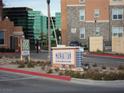 Close-up of Manhattan Condominiums community signage with building details and access point at 50 E Serene Ave # 321, Las Vegas, NV 89123