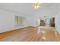 Bright living room with hardwood floors and a view of the kitchen at 5240 Las Cruces Dr, Las Vegas, NV 89130