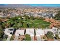 Expansive aerial view showing home's location within a golf course community at 5508 Lochmor Ave, Las Vegas, NV 89130