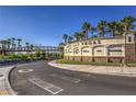 Lake Las Vegas community entrance featuring lush landscaping, signage, and a distinctive bridge under a clear blue sky at 56 Tatahatso Point St, Henderson, NV 89011