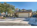 Charming single-story home with a well-maintained lawn and inviting facade in a residential neighborhood at 6225 Sadler Dr, Las Vegas, NV 89130