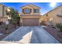 Inviting two-story home with a long driveway and desert landscaping in a well-kept neighborhood at 6365 Diego Dr, Las Vegas, NV 89156