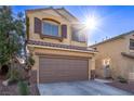 Charming two-story home with a well-maintained front yard, desert landscaping, and an attached two-car garage at 6365 Diego Dr, Las Vegas, NV 89156