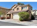Charming two-story home featuring a tile roof, shutters, and a two-car garage at 7173 Dravite Ct, Las Vegas, NV 89148