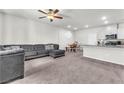 Spacious living room and dining area with natural light and comfortable seating at 7323 Sunray Point St, North Las Vegas, NV 89084