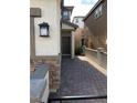 Close up of front door and brick pathway entrance to this home at 8111 Switchback Run St, Las Vegas, NV 89166