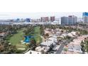 This aerial shot highlights the property's location near a golf course and offers a view of the Las Vegas Strip at 915 Vegas Valley Dr # 4, Las Vegas, NV 89109