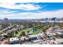 Beautiful aerial view showcases the community, golf course, and the Las Vegas skyline in the background at 915 Vegas Valley Dr # 4, Las Vegas, NV 89109