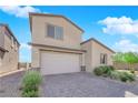 Charming two-story home with stucco siding, desert landscaping, and a two-car garage at 9212 Lunar Effect St, Las Vegas, NV 89143