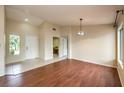 Bright living room with hardwood floors, neutral walls, and large windows providing ample natural light at 9948 Bundella Dr, Las Vegas, NV 89134