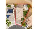 An aerial view shows the property lines, roof, and backyard with outdoor seating area at 1417 Brushback Ave, Henderson, NV 89074