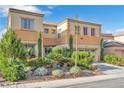 Charming two-story home featuring a two-car garage and desert landscaping at 1604 Danielle Rebecca Ave, North Las Vegas, NV 89086