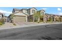 Charming two-story home with a well-maintained front yard and two car garage at 234 Polaris Ridge Ave, Henderson, NV 89011