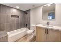Contemporary bathroom with a tub, sleek vanity, modern mirror, and stylish fixtures at 2606 S Durango Dr # 117, Las Vegas, NV 89117