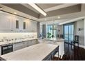 Bright, open kitchen with white cabinets, granite countertops, and city views at 2777 Paradise Rd # 1701, Las Vegas, NV 89109