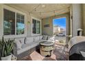 Comfortable covered patio featuring a cozy seating area and stylish decor at 2853 Cabrillo Terrace St, Henderson, NV 89044