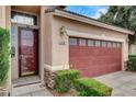 A stucco home displaying the house number above the garage door, framed by manicured hedges at 3200 Ridgecliff St, Las Vegas, NV 89129