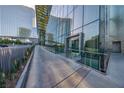 Sleek building entrance with glass accents and modern design, enhanced by landscaping at 3722 Las Vegas Blvd # 2509, Las Vegas, NV 89158