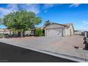 Charming single-story home featuring a two-car garage and low maintenance desert landscaping at 423 Golden Valley Dr, Henderson, NV 89002