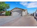 Charming single-story home featuring a two-car garage and low maintenance desert landscaping at 423 Golden Valley Dr, Henderson, NV 89002