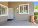 Inviting front entrance with a stylish security door, decorative pot, and well-maintained landscaping at 423 Red Canvas Pl, Las Vegas, NV 89144