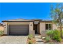 Well maintained single Gathering home with paved driveway and mature desert landscaping at 54 Mirage View Dr, Henderson, NV 89011