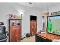 Office space featuring a wooden desk and storage, showcasing potential for productivity at 5424 Neosho St, Las Vegas, NV 89120