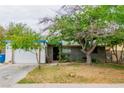 Cozy single-story house with a two-car garage and a mature shade tree at 5600 W Bartlett Ave, Las Vegas, NV 89108