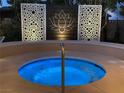 Inviting circular hot tub with custom privacy screens creates a tranquil backyard oasis at 6316 Bluejay Way, Las Vegas, NV 89146