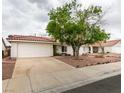 Charming single-story home with a well-maintained front yard and attached two-car garage at 709 Heritage Point Dr, Henderson, NV 89002