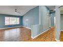 Bright living room with wood-look flooring, neutral walls, and ample natural light at 709 Heritage Point Dr, Henderson, NV 89002