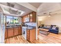 Cozy kitchen featuring granite countertops, a window over the sink, and a dining area at 7200 Pirates Cove Rd # 2071, Las Vegas, NV 89145