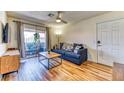 Comfortable living room featuring stylish furnishings and a sliding glass door to the outside at 7200 Pirates Cove Rd # 2071, Las Vegas, NV 89145