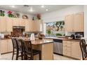 Well-appointed kitchen with granite countertops, stainless steel appliances, and a center island at 8117 Horizon Lake Dr, Las Vegas, NV 89128