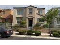 Inviting two-story home with well-kept landscaping and a welcoming facade at 9145 Ebony Threads Ct, Las Vegas, NV 89149