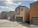 A row of houses with garage parking on a sunny street at 9145 Ebony Threads Ct, Las Vegas, NV 89149