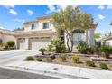 Charming two-story home with well-maintained landscaping, featuring a three-car garage at 9916 Dusty Winds Ave, Las Vegas, NV 89117