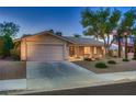 Charming single-story home featuring a well-kept yard, and attached two-car garage at 6316 Bluejay Way, Las Vegas, NV 89146