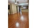Spacious living room boasts shiny hardwood floors and a modern ceiling fan at 10664 Mount Jefferson Ave, Las Vegas, NV 89166