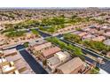 Aerial view of a residential neighborhood with desert landscaping and community parks at 10085 S Riley St, Las Vegas, NV 89178