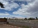 View of the mountains and landscape from the backyard behind a decorative concrete block wall at 4186 Toronto Cir, Las Vegas, NV 89121