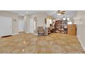 Open living area featuring tile floors, neutral walls, and a versatile layout at 6536 Castor Tree Way, Las Vegas, NV 89108