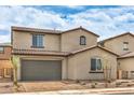 Charming two-story home featuring a two-car garage, tile roof, neutral palette, and appealing landscaping at 89 Oratorio Dr, Henderson, NV 89015