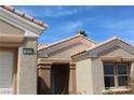 Inviting home entrance with a covered porch and desert landscaping details at 10732 Cedar Creek Ave, Las Vegas, NV 89134