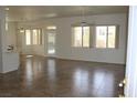 Spacious living room featuring tiled floors, ceiling fans, and multiple windows at 10732 Cedar Creek Ave, Las Vegas, NV 89134