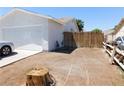 This side yard shows a gate and a path leading to the backyard at 1075 Greymouth St, Las Vegas, NV 89110