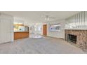 Open floor plan with fireplace, tiled entryway and natural light at 1313 Pinto Rock Ln # 202, Las Vegas, NV 89128